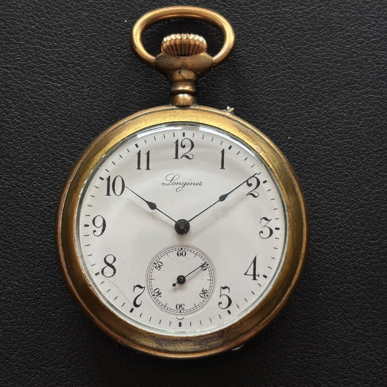 Longines Montre de poche Longines, boîtier hunter à décor d’émail noir et arabesques dorées